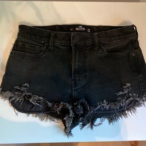 Distressed black advanced stretch Hollister shorts.
